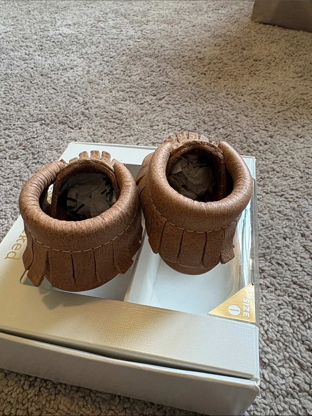 Freshly picked newborn weathered brown moccasins